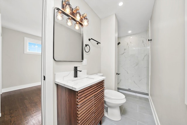 9012 S Harper Ave, Chicago, IL 60619 - bathroom featuring toilet, a marble finish shower, vanity, baseboards, and recessed lighting