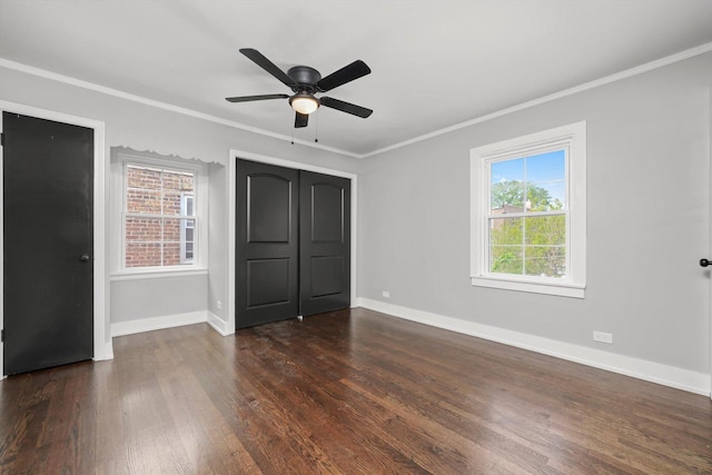 9012 S Harper Ave, Chicago, IL 60619 - unfurnished bedroom featuring crown molding, dark wood-style floors, baseboards, and ceiling fan