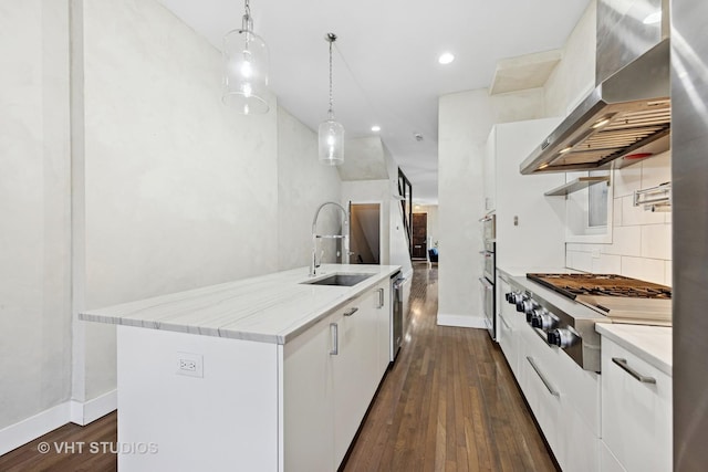 3342 S Giles Ave, Chicago, IL 60616 - kitchen with appliances with stainless steel finishes, wall chimney range hood, a sink, white cabinets, and dark wood-style floors