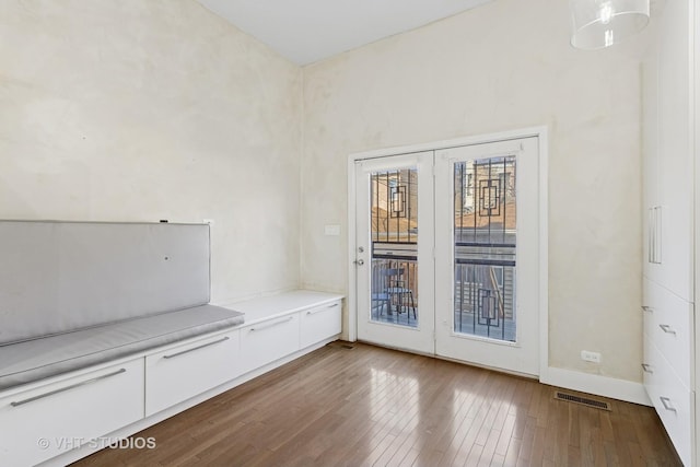 3342 S Giles Ave, Chicago, IL 60616 - empty room featuring hardwood / wood-style flooring, french doors, and baseboards
