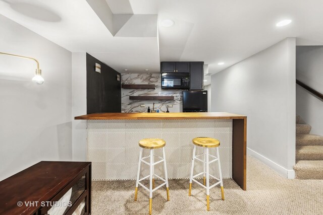 3342 S Giles Ave, Chicago, IL 60616 - kitchen featuring black microwave, fridge, carpet flooring, a kitchen bar, and recessed lighting