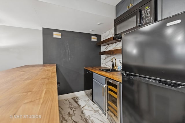 3342 S Giles Ave, Chicago, IL 60616 - kitchen with freestanding refrigerator, wooden counters, beverage cooler, open shelves, and a sink