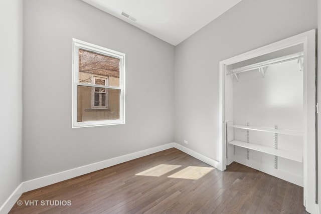 3342 S Giles Ave, Chicago, IL 60616 - unfurnished bedroom with hardwood / wood-style floors and baseboards