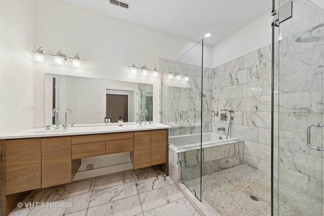 3342 S Giles Ave, Chicago, IL 60616 - full bath with marble look tile flooring, double vanity, a bath, and a shower stall