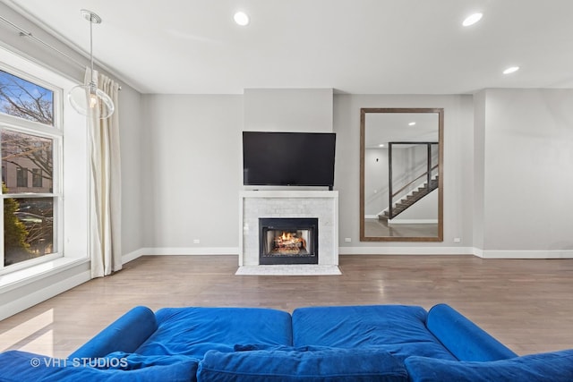 3342 S Giles Ave, Chicago, IL 60616 - living room with wood finished floors, baseboards, a lit fireplace, and recessed lighting