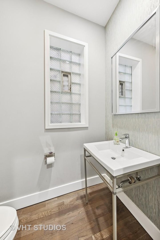 3342 S Giles Ave, Chicago, IL 60616 - bathroom featuring wood finished floors, toilet, and baseboards