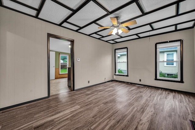 913 N Mason St, Bloomington, IL 61701 - spare room featuring wood finished floors, healthy amount of natural light, ceiling fan, and baseboards