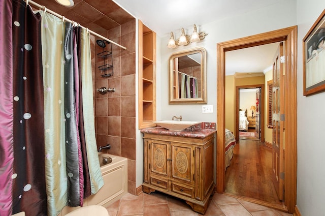 1902 N 77th Ct, Elmwood Park, IL 60707 - ensuite bathroom featuring shower / bath combination with curtain, vanity, crown molding, and tile patterned floors
