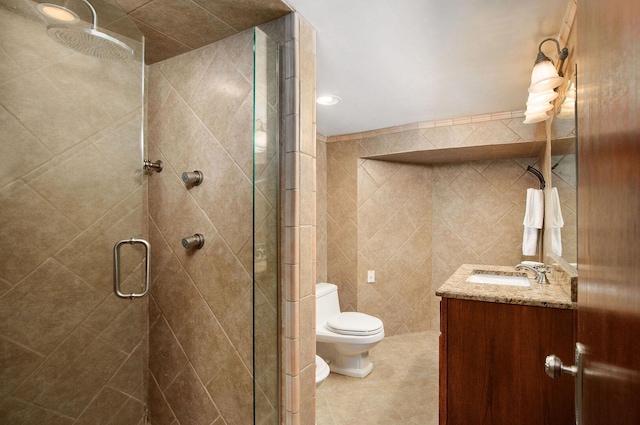 1902 N 77th Ct, Elmwood Park, IL 60707 - bathroom featuring a stall shower, vanity, tile walls, and tile patterned floors