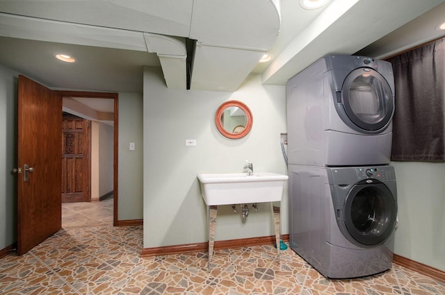 1902 N 77th Ct, Elmwood Park, IL 60707 - laundry room with stacked washer / drying machine and stone finish flooring