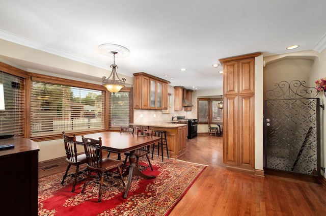 1902 N 77th Ct, Elmwood Park, IL 60707 - dining space with light wood-type flooring, ornamental molding, and recessed lighting