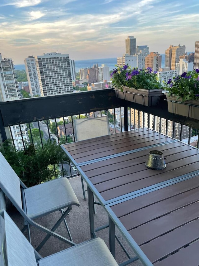 1255 N Sandburg Ter Unit 2912, Chicago, IL 60610 - balcony at dusk featuring a view of city
