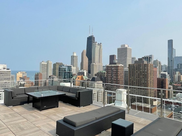 1255 N Sandburg Ter Unit 2912, Chicago, IL 60610 - view of patio / terrace featuring an outdoor living space with a fire pit and a skyline view