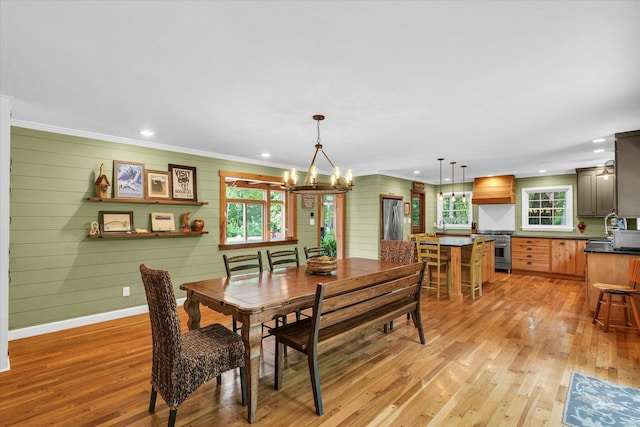 2804 E Concord Rd, Urbana, IL 61802 - dining room featuring plenty of natural light, a chandelier, light wood finished floors, crown molding, and recessed lighting