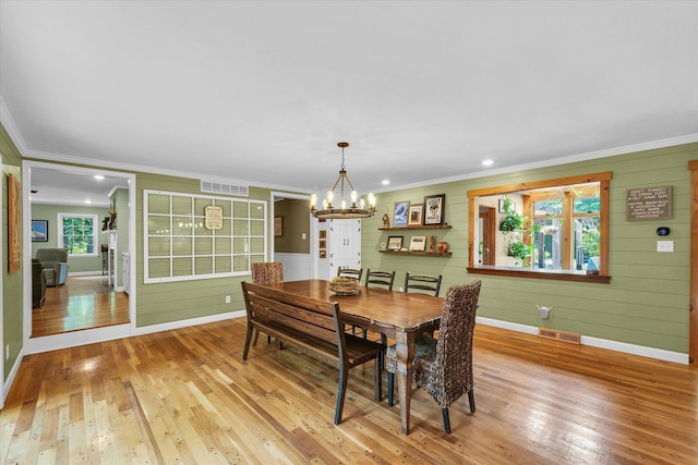 2804 E Concord Rd, Urbana, IL 61802 - dining room with crown molding, a chandelier, wood-type flooring, recessed lighting, and wooden walls