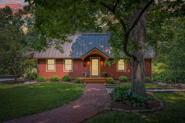 2804 E Concord Rd, Urbana, IL 61802 - view of front of home featuring a standing seam roof, a metal roof, and a yard