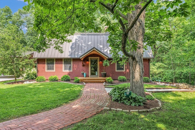 2804 E Concord Rd, Urbana, IL 61802 - view of front of home with a front lawn, a metal roof, and a standing seam roof