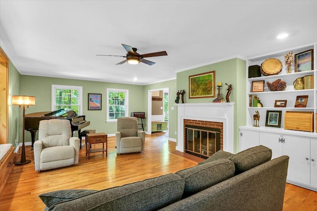 2804 E Concord Rd, Urbana, IL 61802 - living room featuring light wood finished floors, ceiling fan, crown molding, a fireplace, and recessed lighting