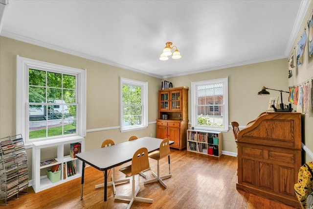 2804 E Concord Rd, Urbana, IL 61802 - dining area featuring healthy amount of natural light, ornamental molding, and light wood-type flooring