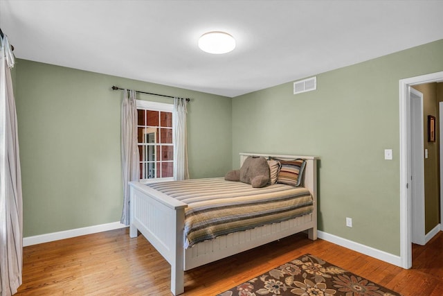 2804 E Concord Rd, Urbana, IL 61802 - bedroom featuring baseboards and wood finished floors