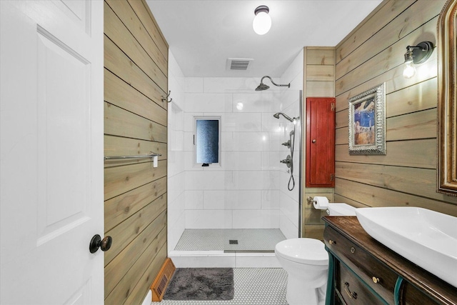 2804 E Concord Rd, Urbana, IL 61802 - bathroom featuring wooden walls, a stall shower, vanity, and tile patterned flooring