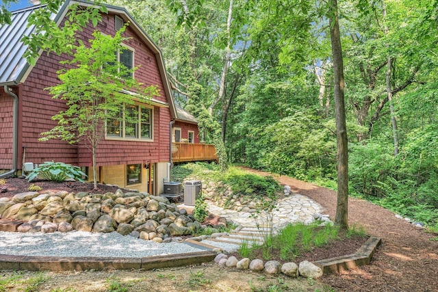 2804 E Concord Rd, Urbana, IL 61802 - view of property exterior featuring a wooden deck and a central air condition unit