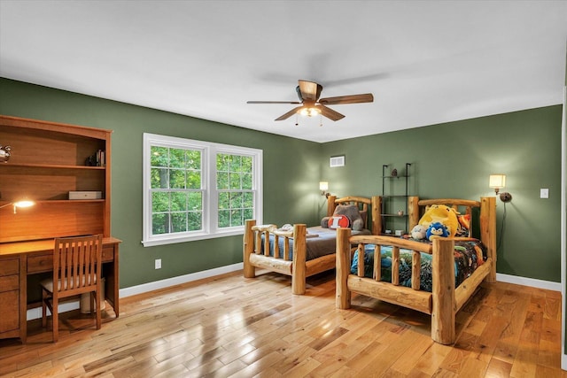 2804 E Concord Rd, Urbana, IL 61802 - bedroom featuring light wood-style flooring, a desk, and ceiling fan