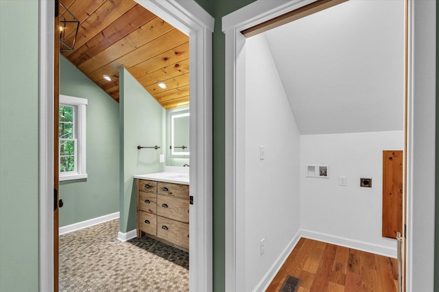 2804 E Concord Rd, Urbana, IL 61802 - bathroom with lofted ceiling, vanity, wood ceiling, and wood finished floors
