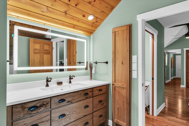 2804 E Concord Rd, Urbana, IL 61802 - bathroom with vaulted ceiling, wood finished floors, vanity, and a ceiling fan