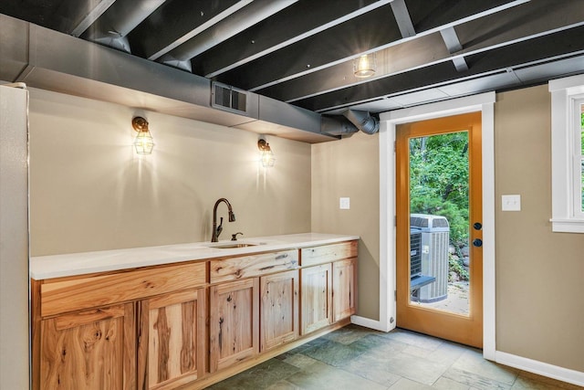 2804 E Concord Rd, Urbana, IL 61802 - bar area with a sink and light stone finish floors
