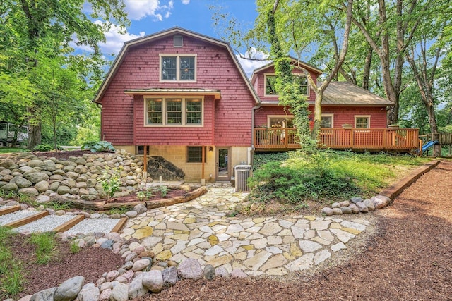 2804 E Concord Rd, Urbana, IL 61802 - back of house with a deck, a gambrel roof, and a patio area