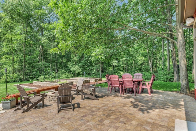 2804 E Concord Rd, Urbana, IL 61802 - view of patio featuring outdoor dining area and a fire pit