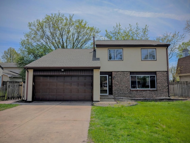 235 E Manchester Dr, Wheeling, IL 60090 - view of front of home with an attached garage, driveway, and brick siding