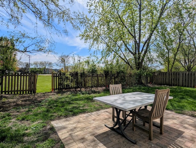 235 E Manchester Dr, Wheeling, IL 60090 - fenced backyard with outdoor dining area and a patio area