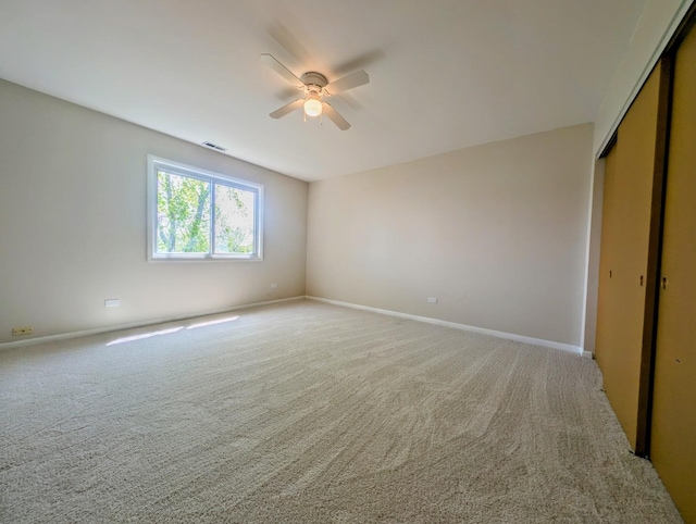 235 E Manchester Dr, Wheeling, IL 60090 - unfurnished bedroom featuring light carpet, a closet, and ceiling fan