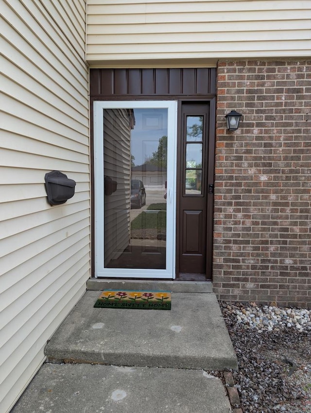 235 E Manchester Dr, Wheeling, IL 60090 - doorway to property featuring brick siding