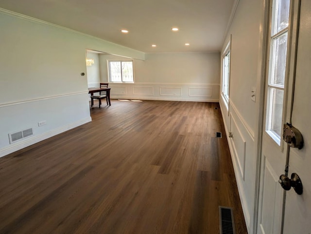 235 E Manchester Dr, Wheeling, IL 60090 - unfurnished room with crown molding, a decorative wall, dark wood-style floors, wainscoting, and recessed lighting