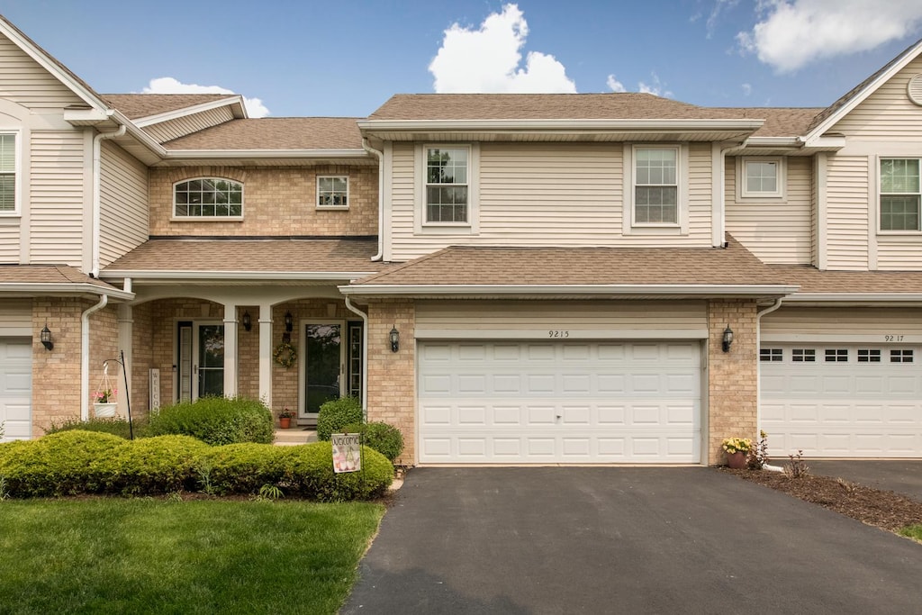 9215 Waterfall Glen Blvd, Darien, IL 60561 - multi unit property with driveway, a garage, and roof with shingles