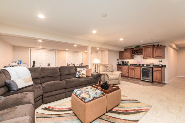 9215 Waterfall Glen Blvd, Darien, IL 60561 - living room with wet bar, beverage cooler, recessed lighting, light carpet, and baseboards
