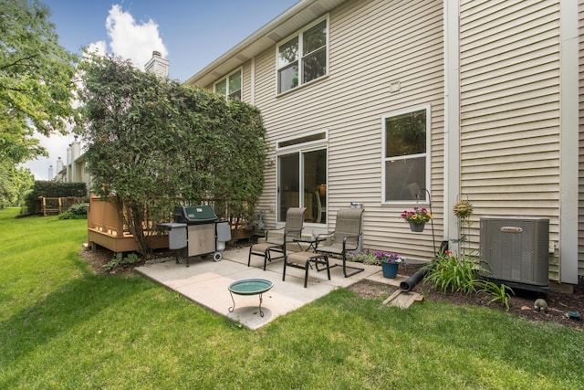 9215 Waterfall Glen Blvd, Darien, IL 60561 - back of property with cooling unit, a patio, and a lawn