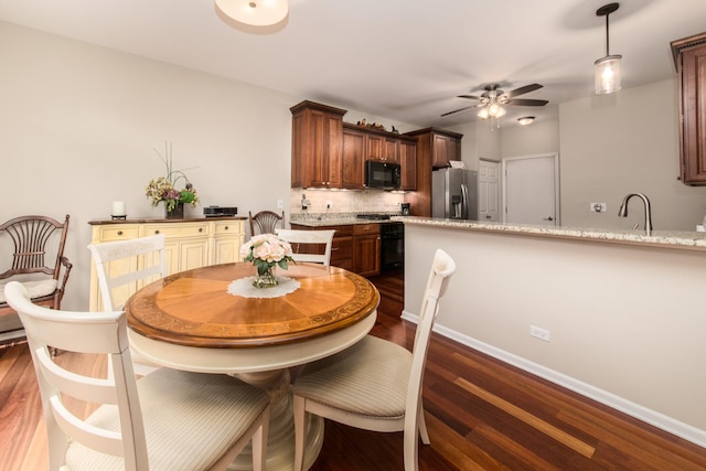 9215 Waterfall Glen Blvd, Darien, IL 60561 - dining space with ceiling fan, dark wood-style flooring, and baseboards