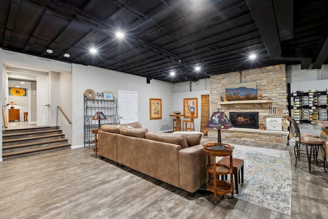 1424 Glencoe Ave, Highland Park, IL 60035 - living room featuring wood finished floors, a stone fireplace, and stairway