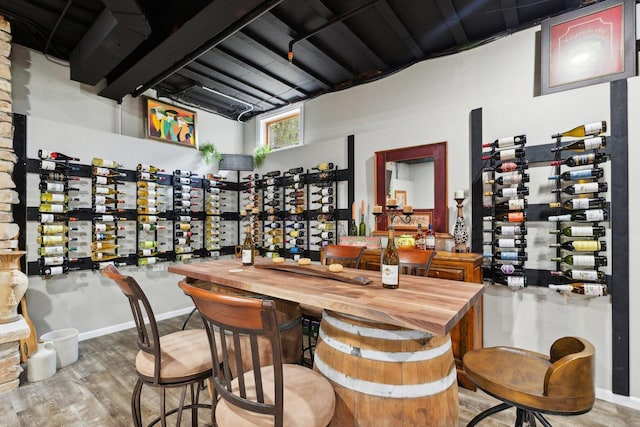 1424 Glencoe Ave, Highland Park, IL 60035 - wine area featuring a towering ceiling, wood finished floors, and baseboards