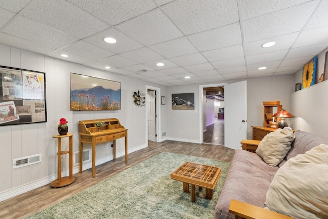 1424 Glencoe Ave, Highland Park, IL 60035 - living area featuring wood finished floors, a paneled ceiling, baseboards, and recessed lighting