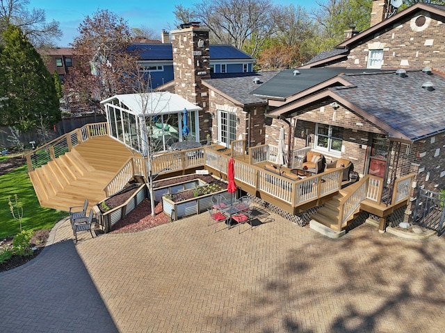 1424 Glencoe Ave, Highland Park, IL 60035 - rear view of house featuring a deck, a shingled roof, stairs, and brick siding