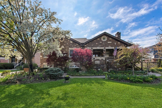 1424 Glencoe Ave, Highland Park, IL 60035 - view of front facade with a chimney and brick siding