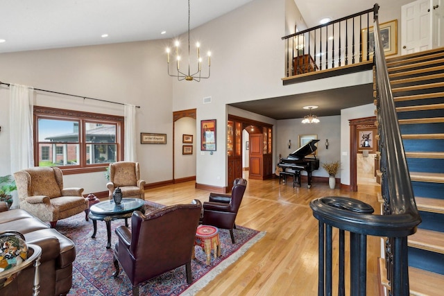 1424 Glencoe Ave, Highland Park, IL 60035 - living area featuring a chandelier, stairway, light wood-style floors, baseboards, and high vaulted ceiling