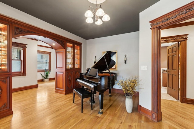 1424 Glencoe Ave, Highland Park, IL 60035 - living area with light wood-type flooring, baseboards, and a chandelier