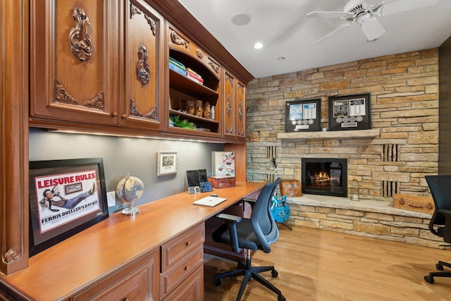 1424 Glencoe Ave, Highland Park, IL 60035 - home office featuring built in study area, ceiling fan, wood finished floors, a stone fireplace, and recessed lighting