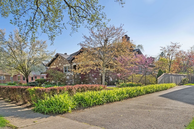 1424 Glencoe Ave, Highland Park, IL 60035 - view of property exterior with a chimney and brick siding